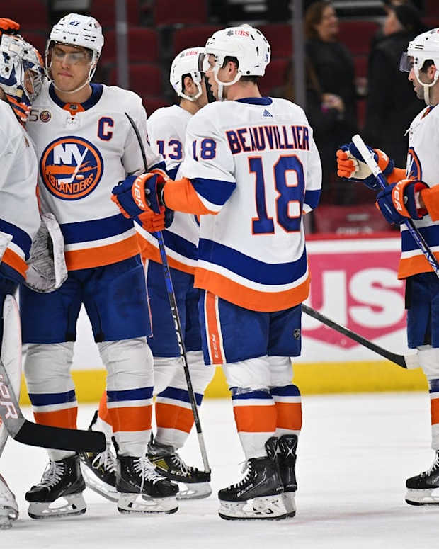 Nov 1, 2022; Chicago, Illinois, USA; New York Islanders goaltender Ilya Sorokin (30) celebrates with forward Anders Lee (27) after defeating the Chicago Blackhawks 3-1 at the United Center. Mandatory Credit: Jamie Sabau-USA TODAY Sports